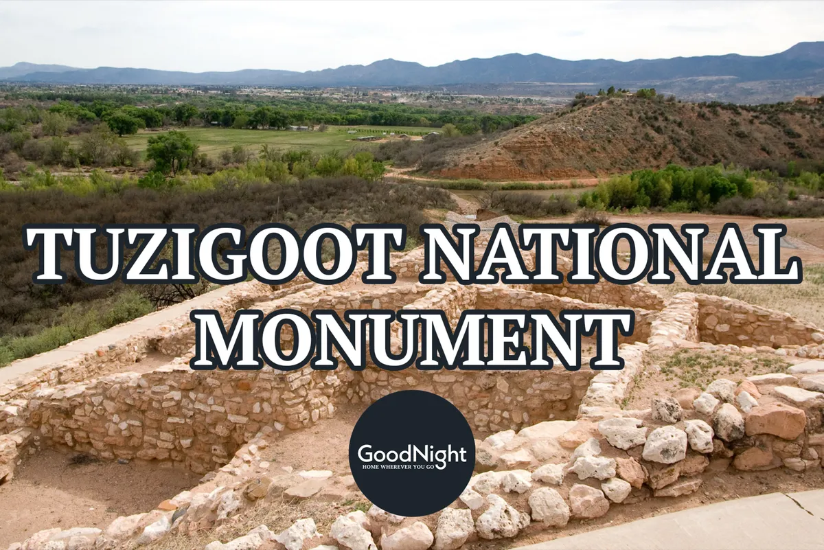 Ancient stone ruins set in a lush green landscape with a mountain backdrop, evoking both history and the natural beauty of the region. The scene is tranquil and reflective, inviting guests to imagine exploring heritage sites and connecting with the past.